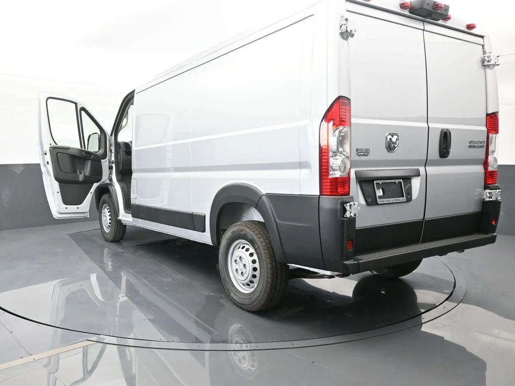 Used 2025 Bright Silver Clearcoat Metallic Ram Low Roof image 67