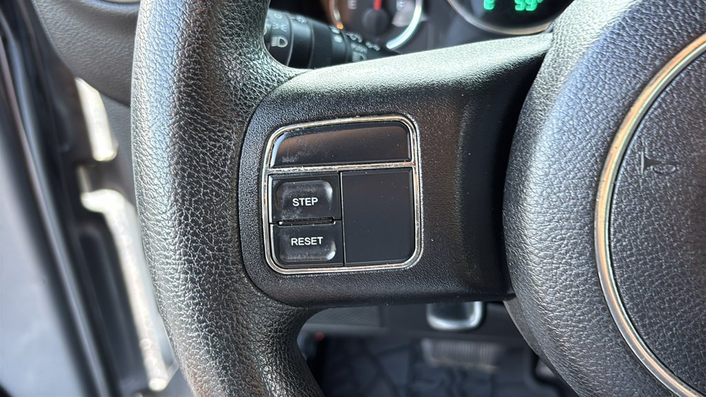 Used 2013 Billet Clearcoat Metallic Jeep Unlimited Sport image 11