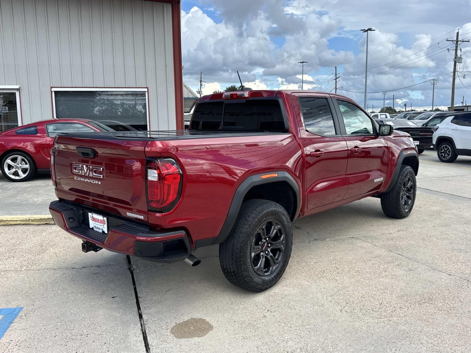 Used 2025 Volcanic Red Tintcoat GMC 2WD Elevation image 7
