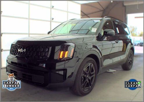 Used 2024 Ebony Black Kia EX X-Line image 1