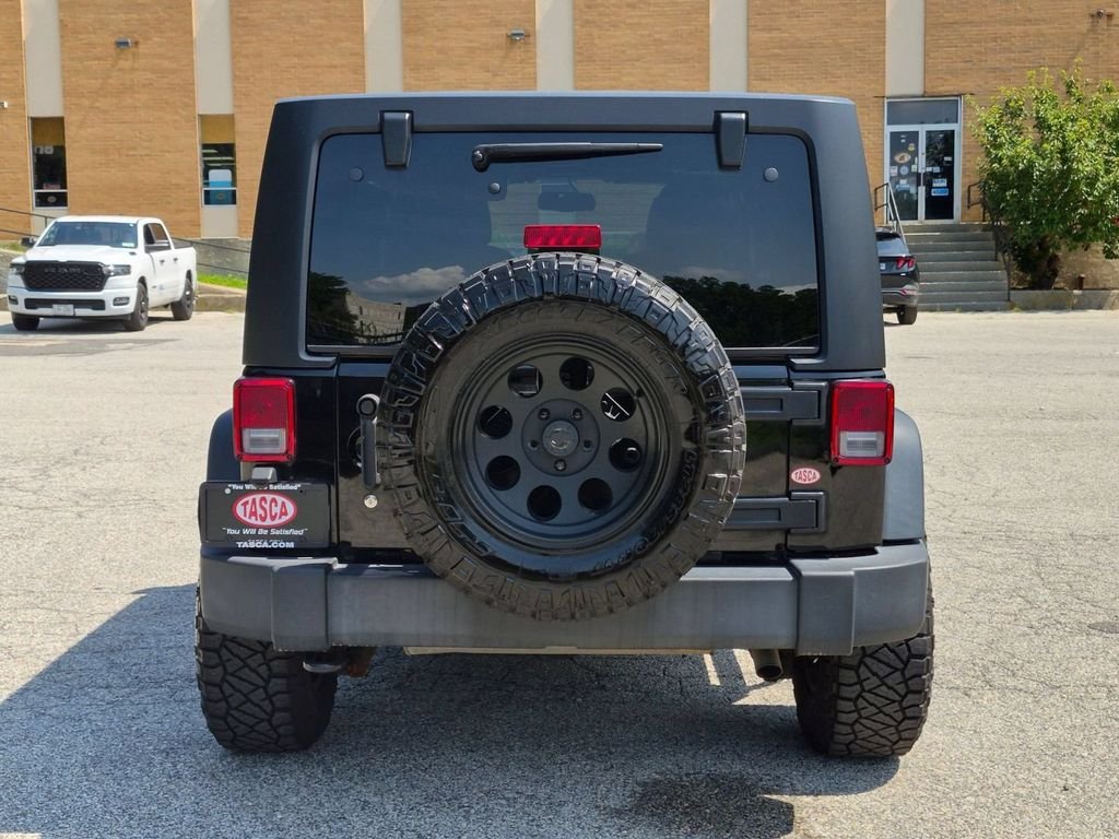 Used 2016 Black Jeep Unlimited Sport image 4