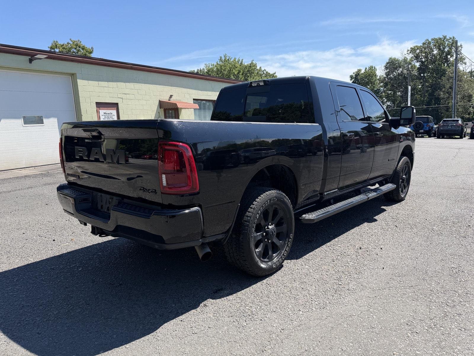 Used 2025 Diamond Black Crystal Pearlcoat Ram Laramie image 3