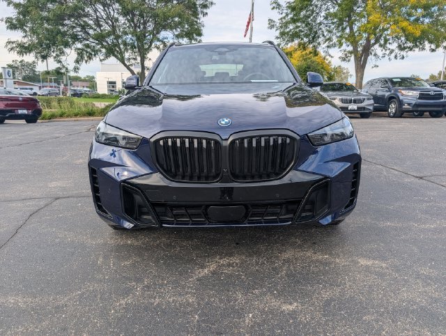 Certified Used 2026 Tanzanite Blue II Metallic BMW xDrive50e image 9