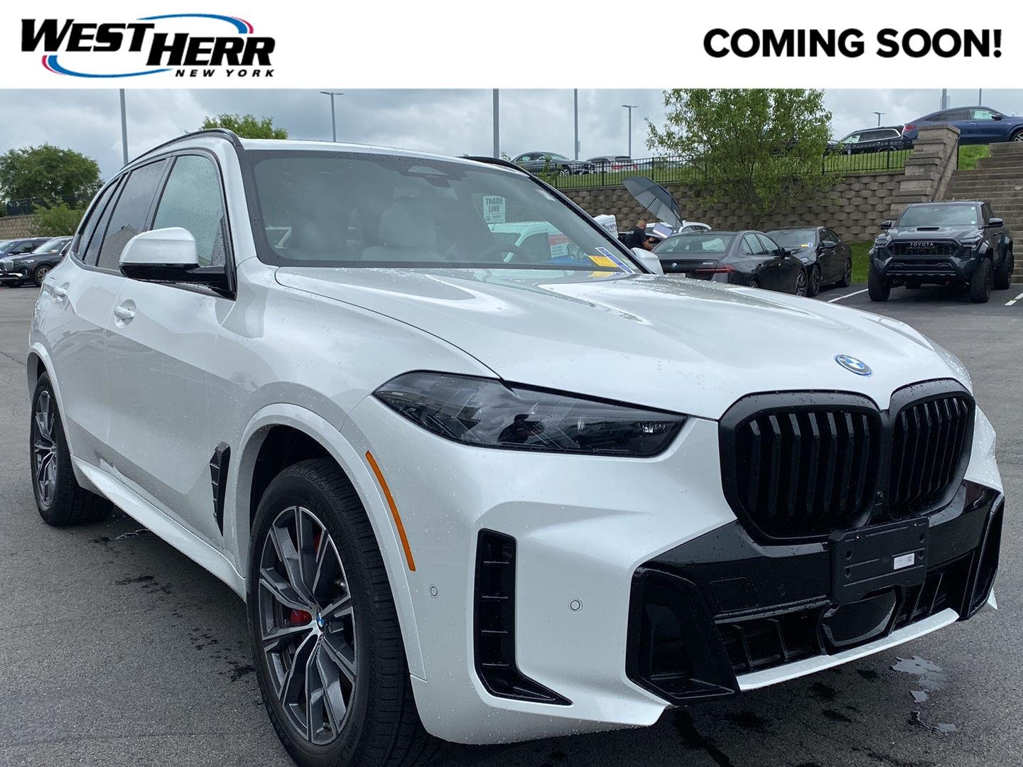 Used 2026 Mineral White Metallic BMW xDrive50e image 1