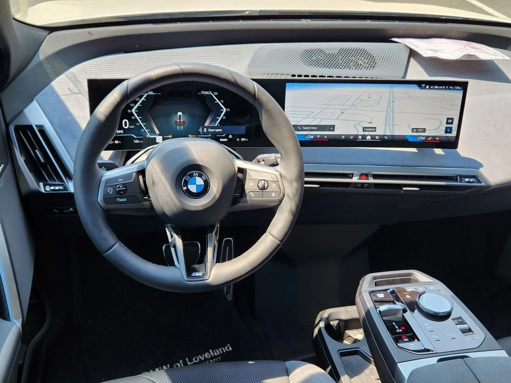 Used 2026 White Metallic BMW xDrive60 image 9