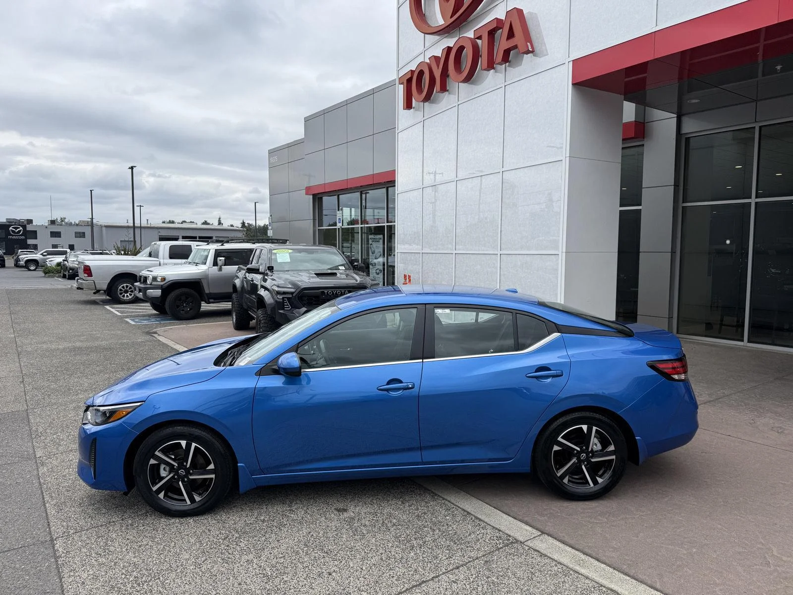 Used 2024 Electric Blue Metallic Nissan SV image 3