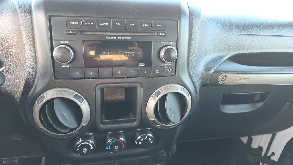 Used 2013 White Jeep Unlimited Sport image 17