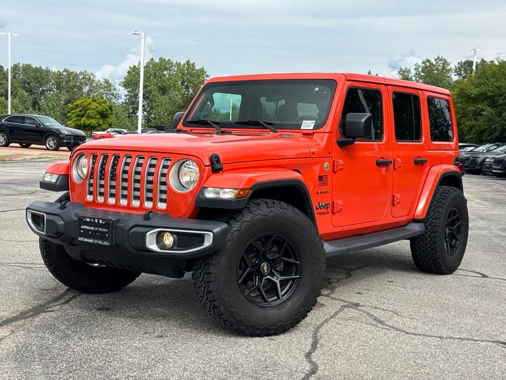 Used 2019 Orange Jeep Unlimited Sahara image 1