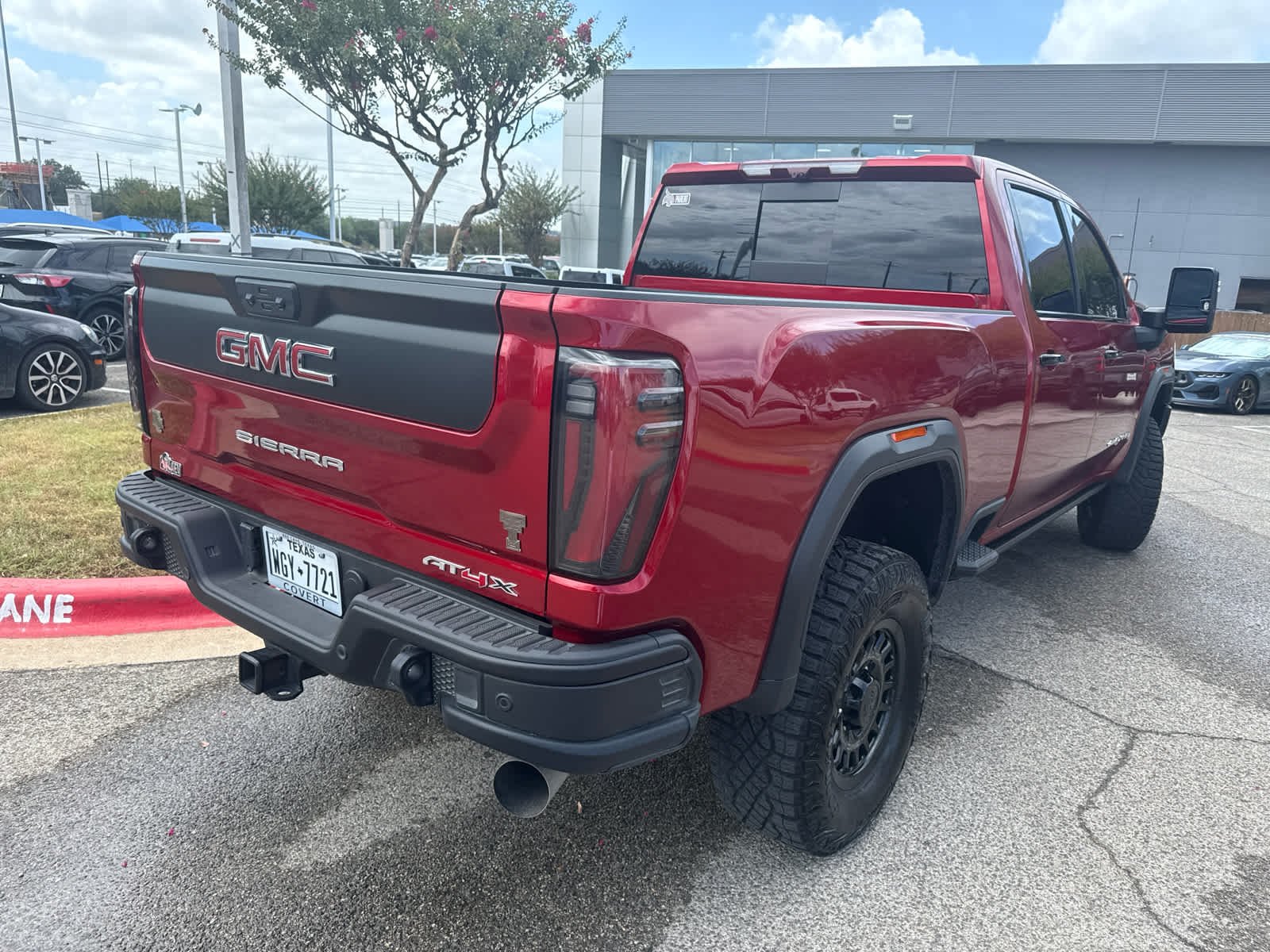 Used 2025 Volcanic Red Tintcoat GMC AT4X image 4