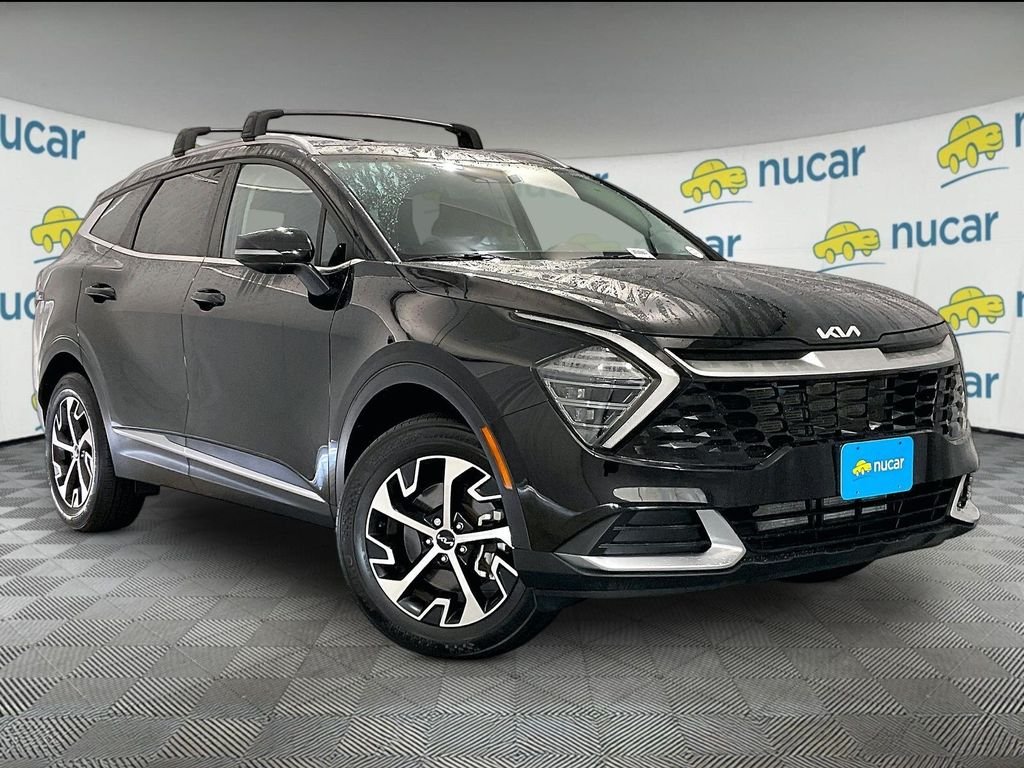 Used 2024 Ebony Black Kia EX image 1