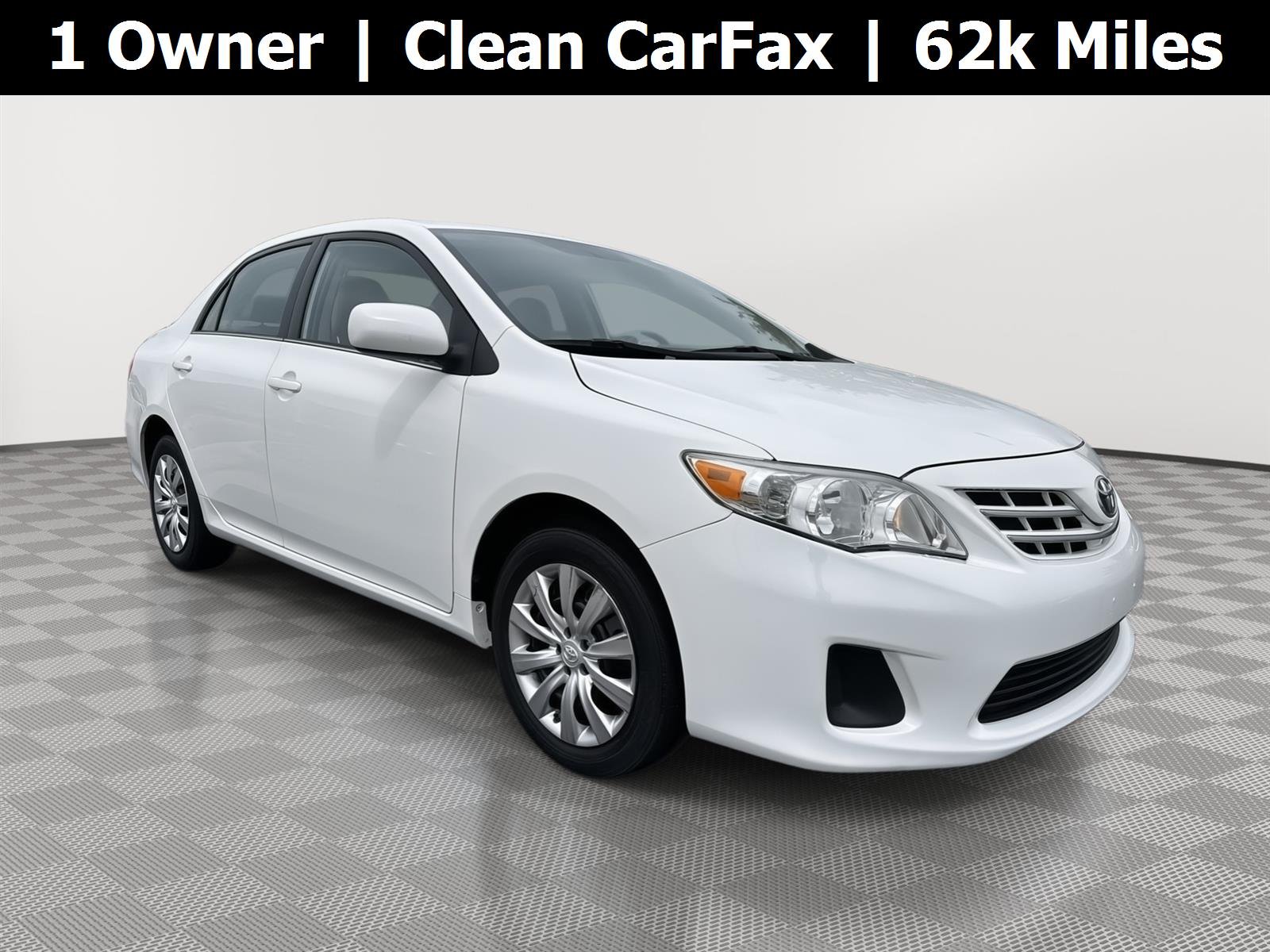 Used 2013 Super White Toyota LE image 1
