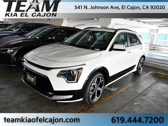 Certified Used 2023 White Kia EX Touring image 1