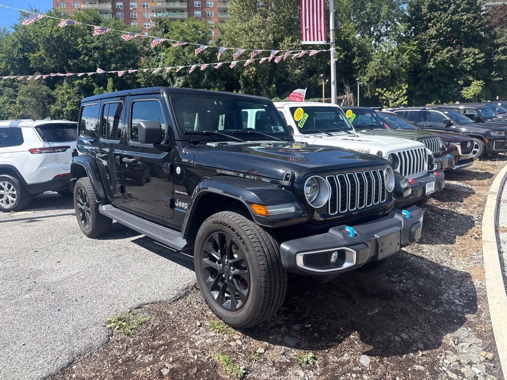 Used 2024 Black Jeep Sahara 4xe image 1