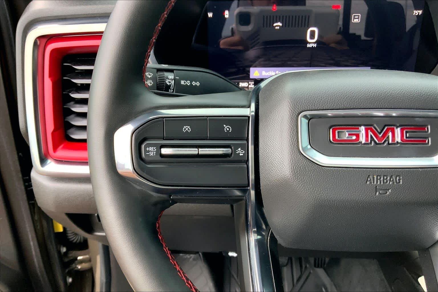 Used 2024 Deep Bronze Metallic GMC 4WD AT4X image 24