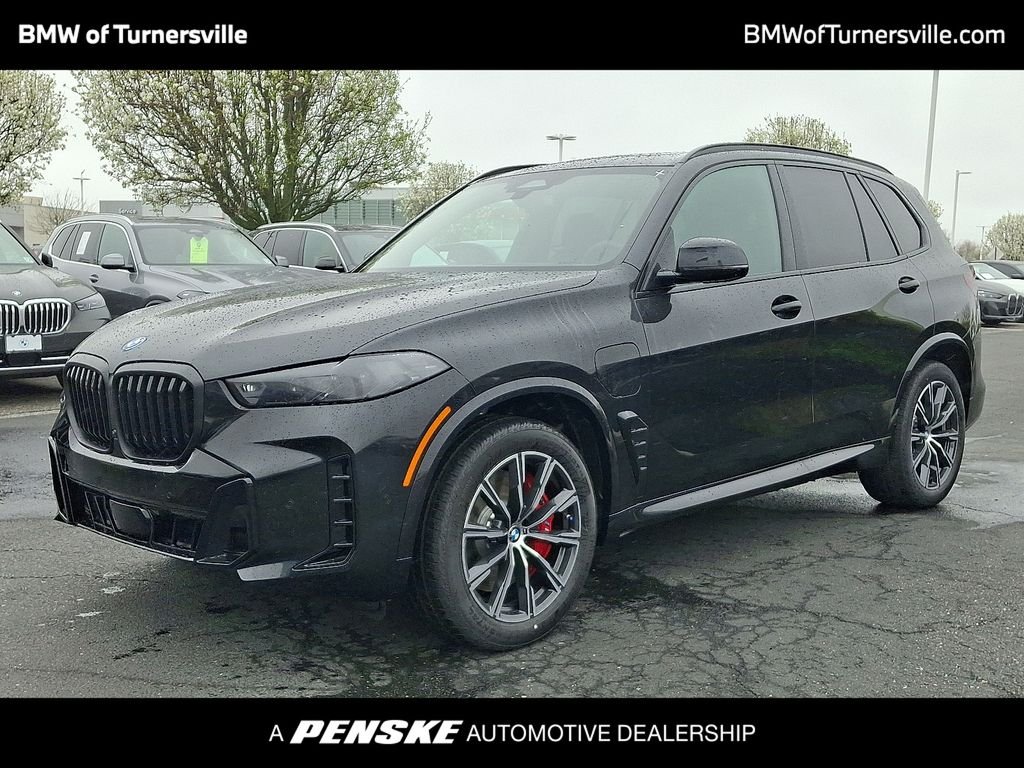 Used 2026 Black Sapphire Metallic BMW xDrive50e image 1