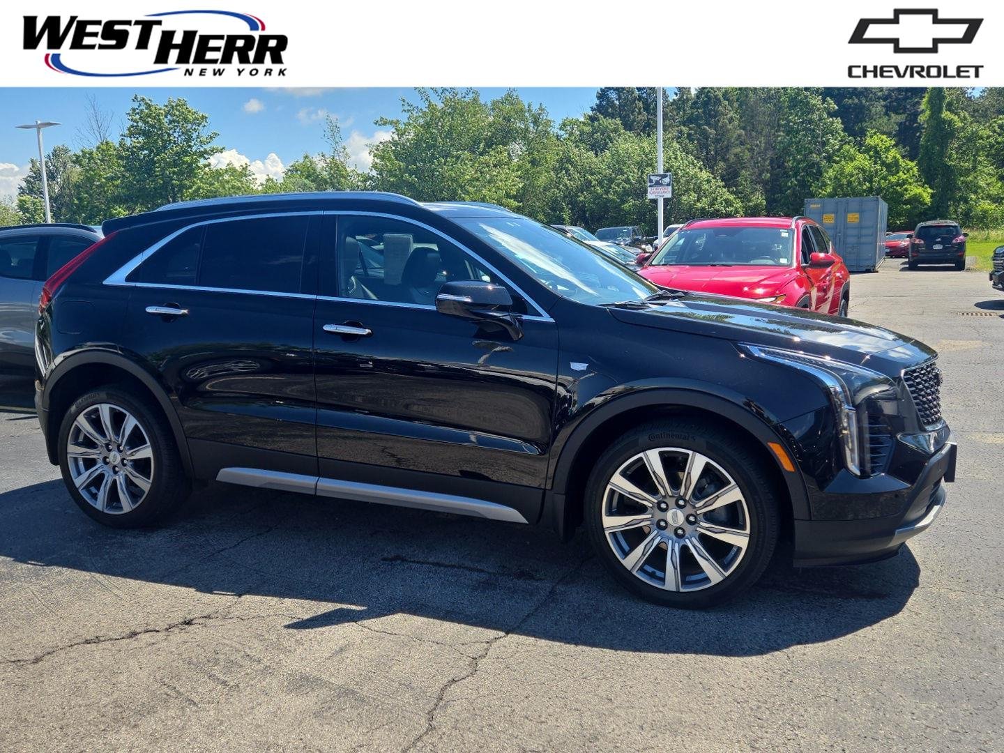 Used 2023 Stellar Black Metallic Cadillac AWD Premium Luxury image 1