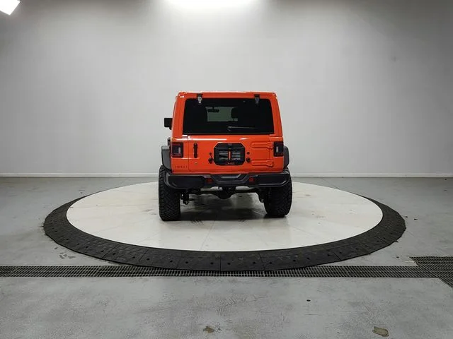 Used 2018 Orange Jeep Unlimited Sahara image 6