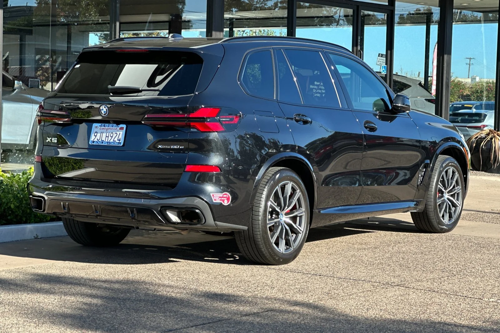 Used 2024 Black Sapphire Metallic BMW xDrive50e image 4