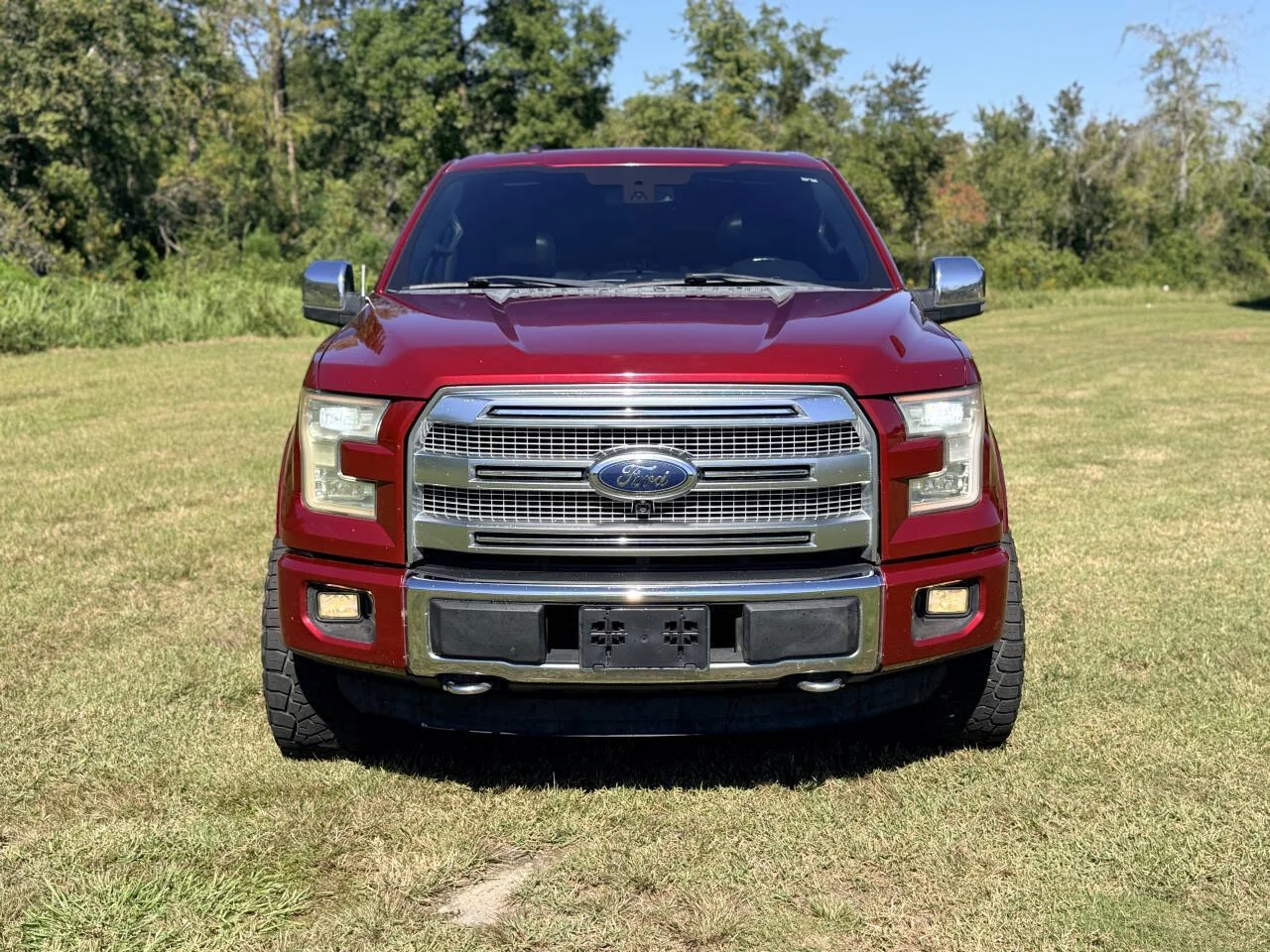 Used 2015 Red Ford Platinum 4x4 4dr SuperCrew 5.5 ft. SB image 9