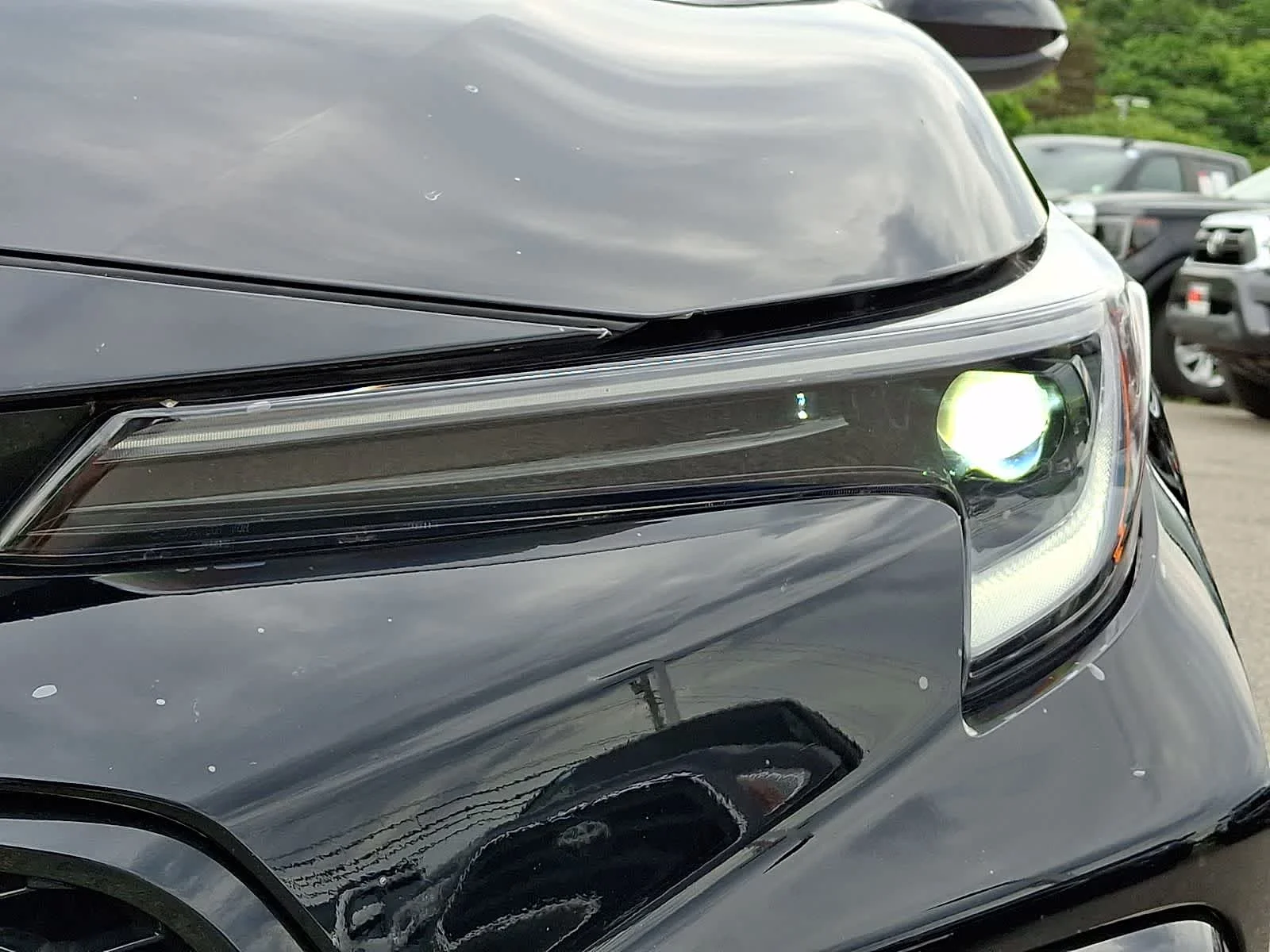 Used 2024 Midnight Black Metallic Toyota Hybrid SE image 12