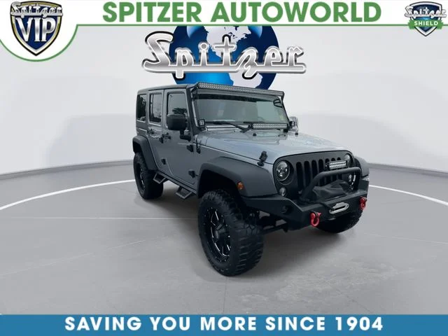 Used 2015 Silver Jeep Unlimited Sport image 2