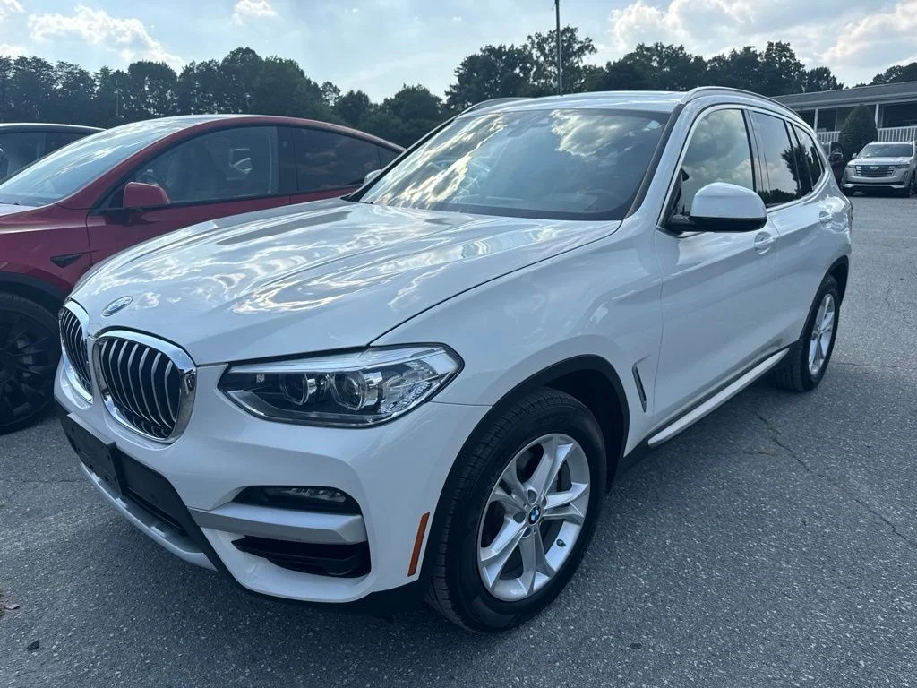 Used 2021 White BMW sDrive30i image 1
