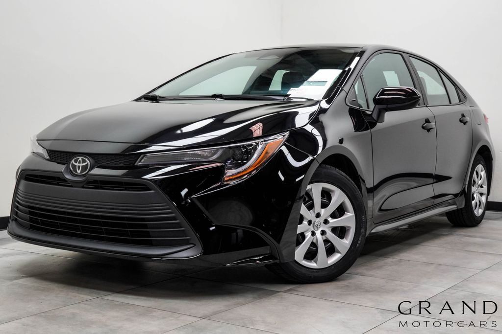 Used 2024 Black Toyota LE image 1