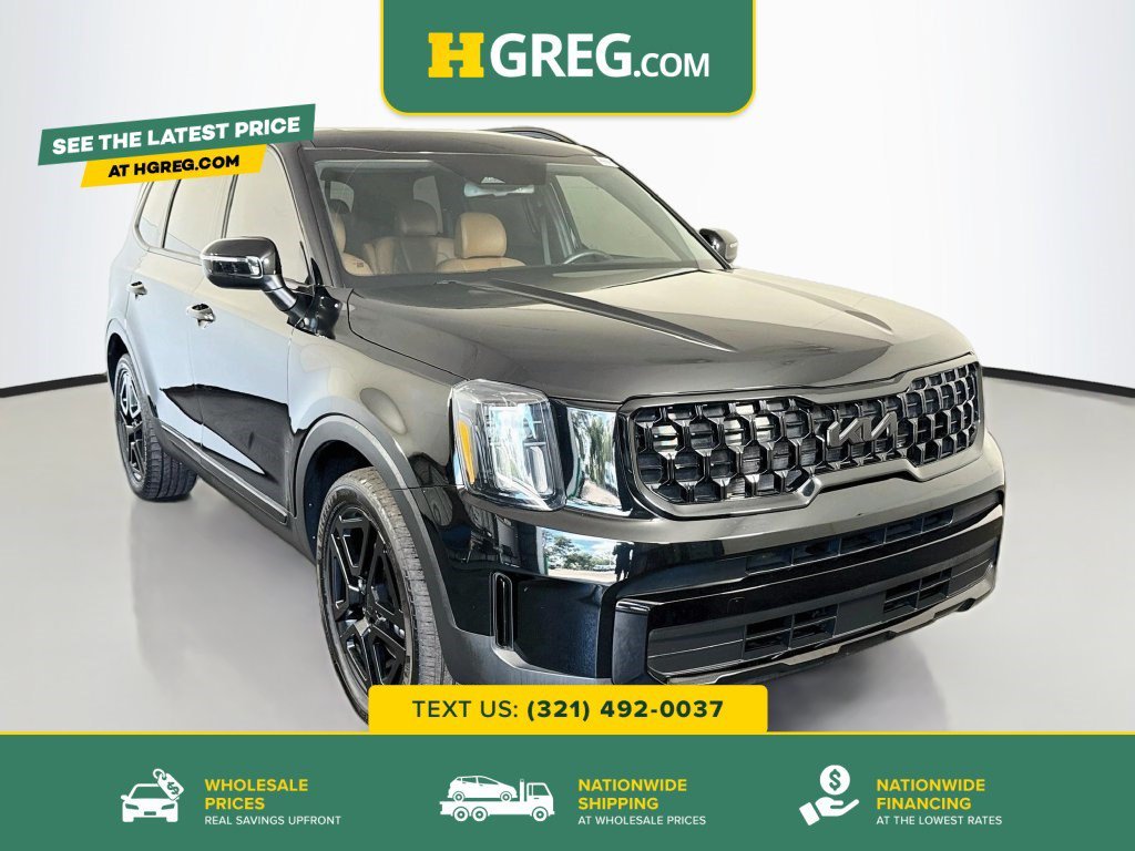 Used 2025 Ebony Black Kia EX X-Line image 1