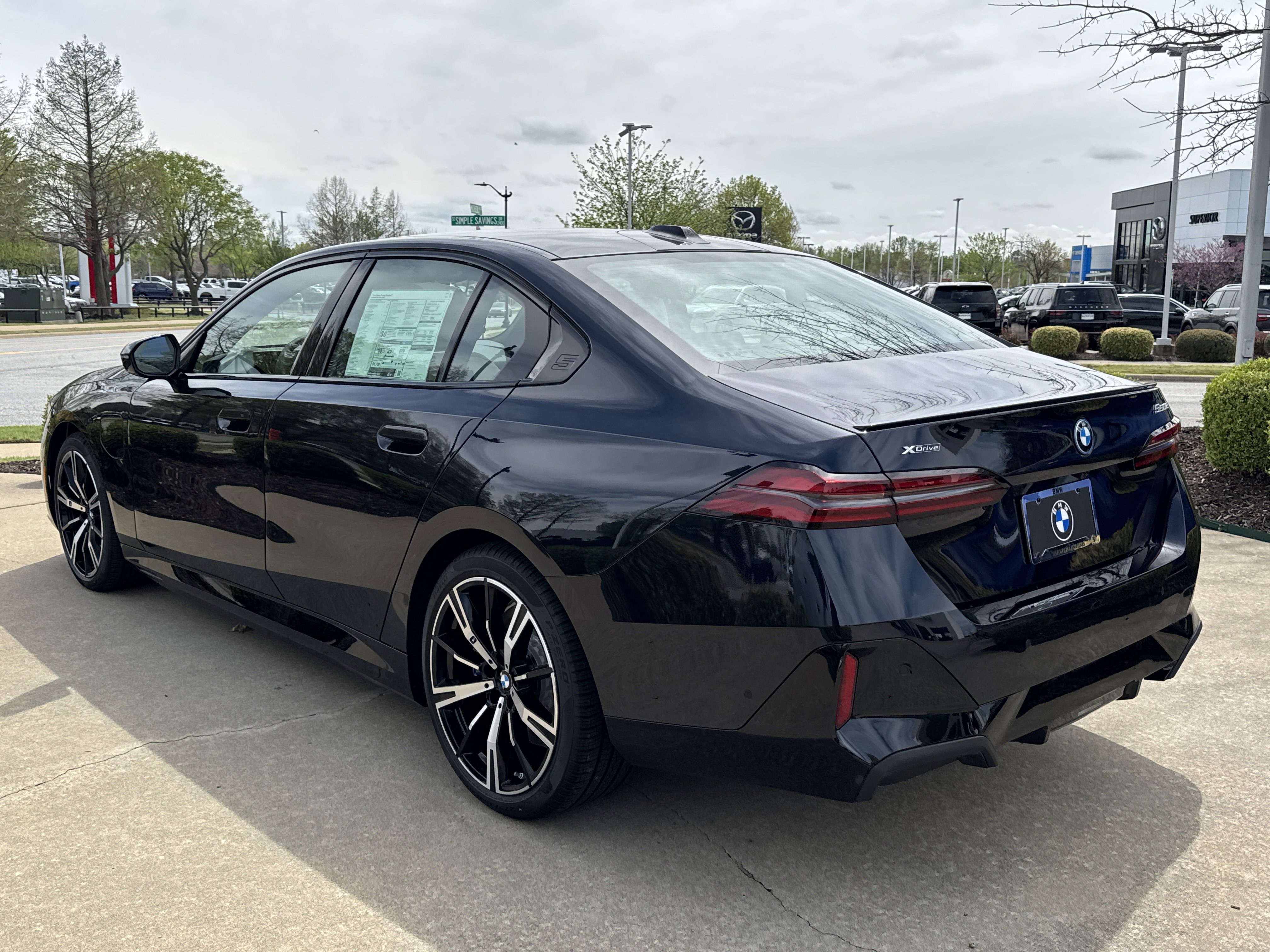 New 2026 CARBON BLACK BMW 550e xDrive image 3