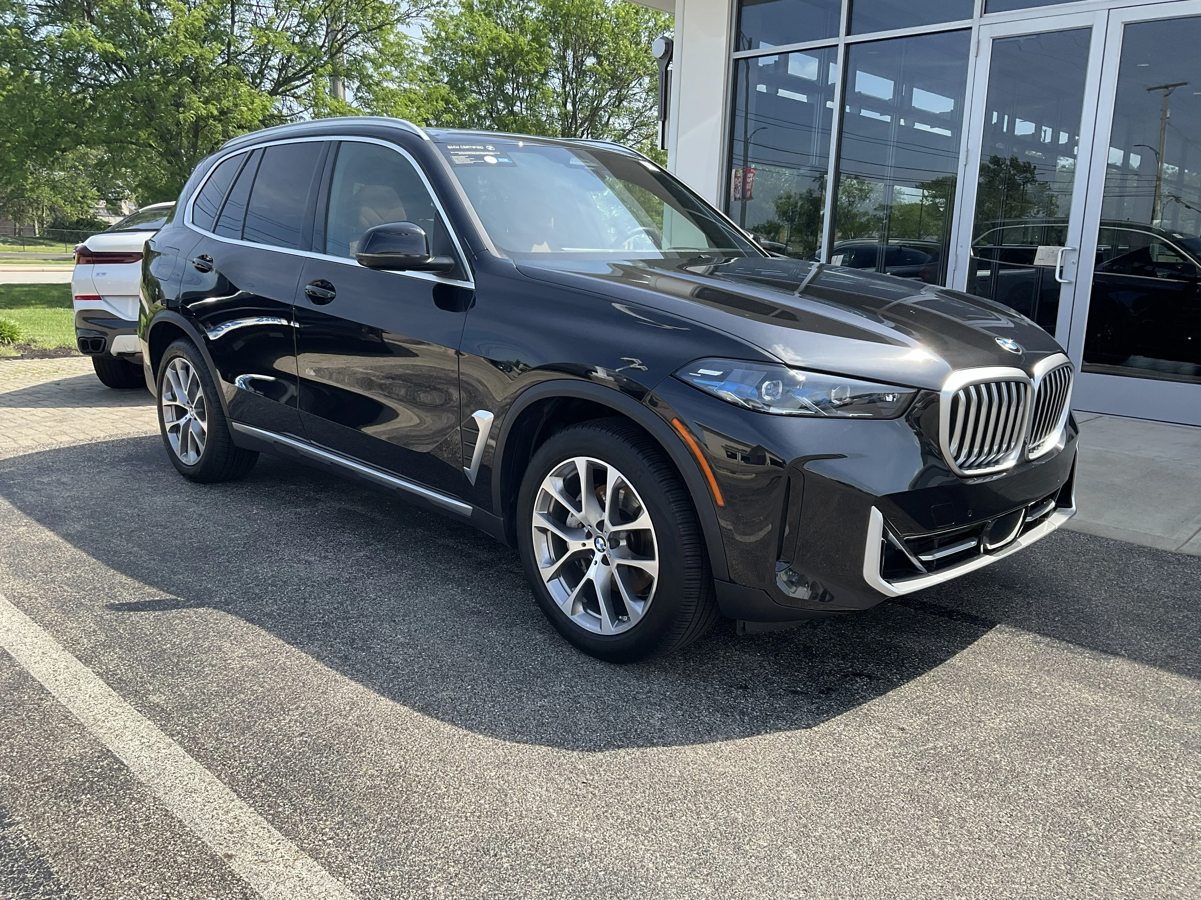 Certified Used 2024 Black Sapphire Metallic BMW xDrive40i image 1