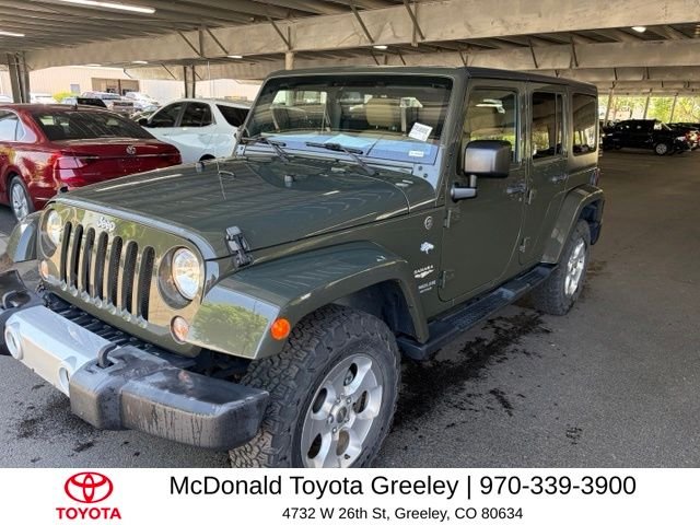 Used 2015 Green Jeep Unlimited Sahara image 1