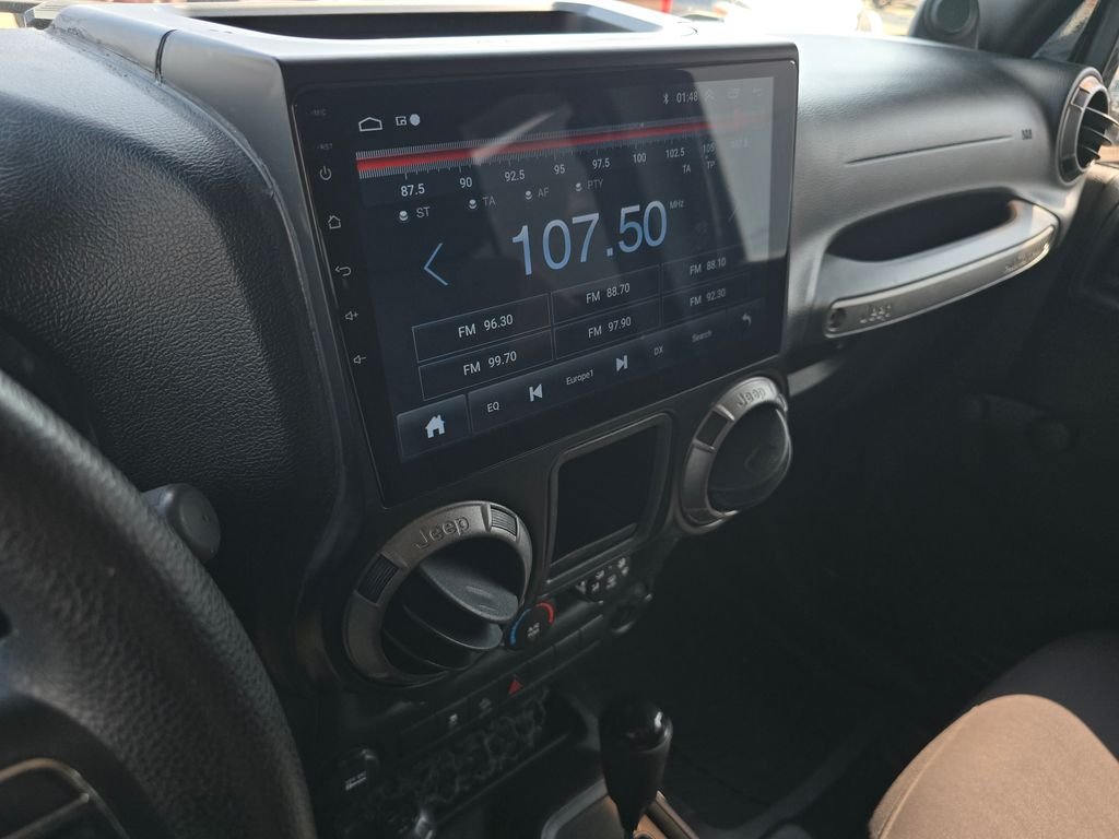 Used 2013 Black Jeep Unlimited Sport image 24
