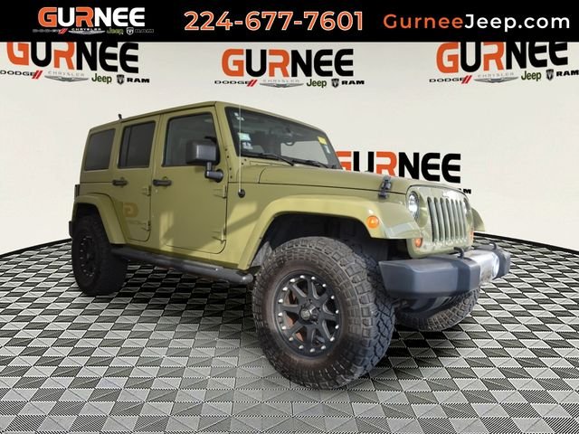 Used 2013 Green Jeep Unlimited Sahara image 1