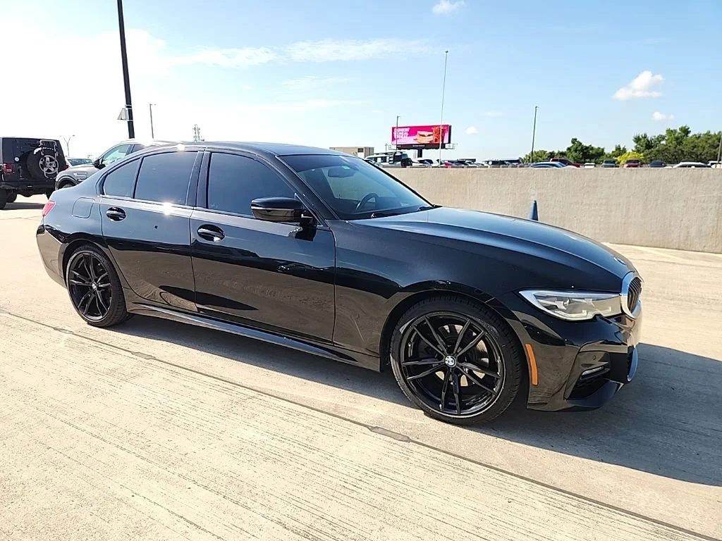 Used 2021 Black Sapphire Metallic BMW 330i xDrive image 1
