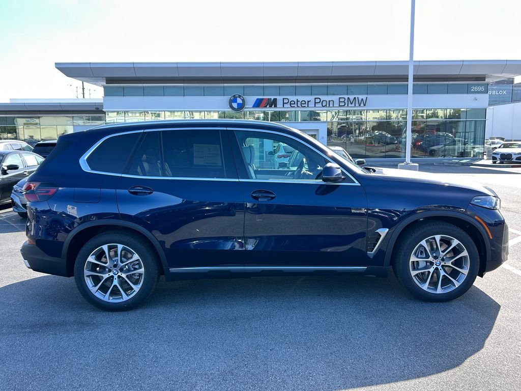 New 2026 Tanzanite Blue II Metallic BMW xDrive50e image 6