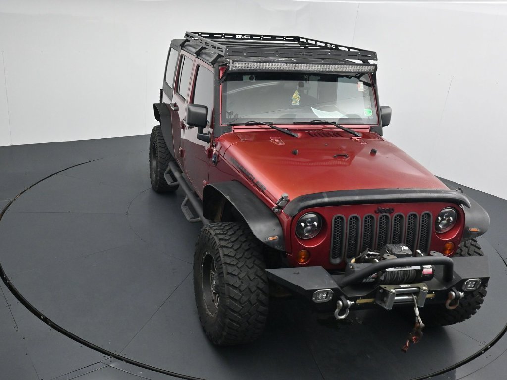 Used 2012 Red Jeep Unlimited Sport image 10