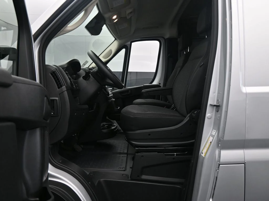 Used 2025 Bright Silver Clearcoat Metallic Ram Low Roof image 10