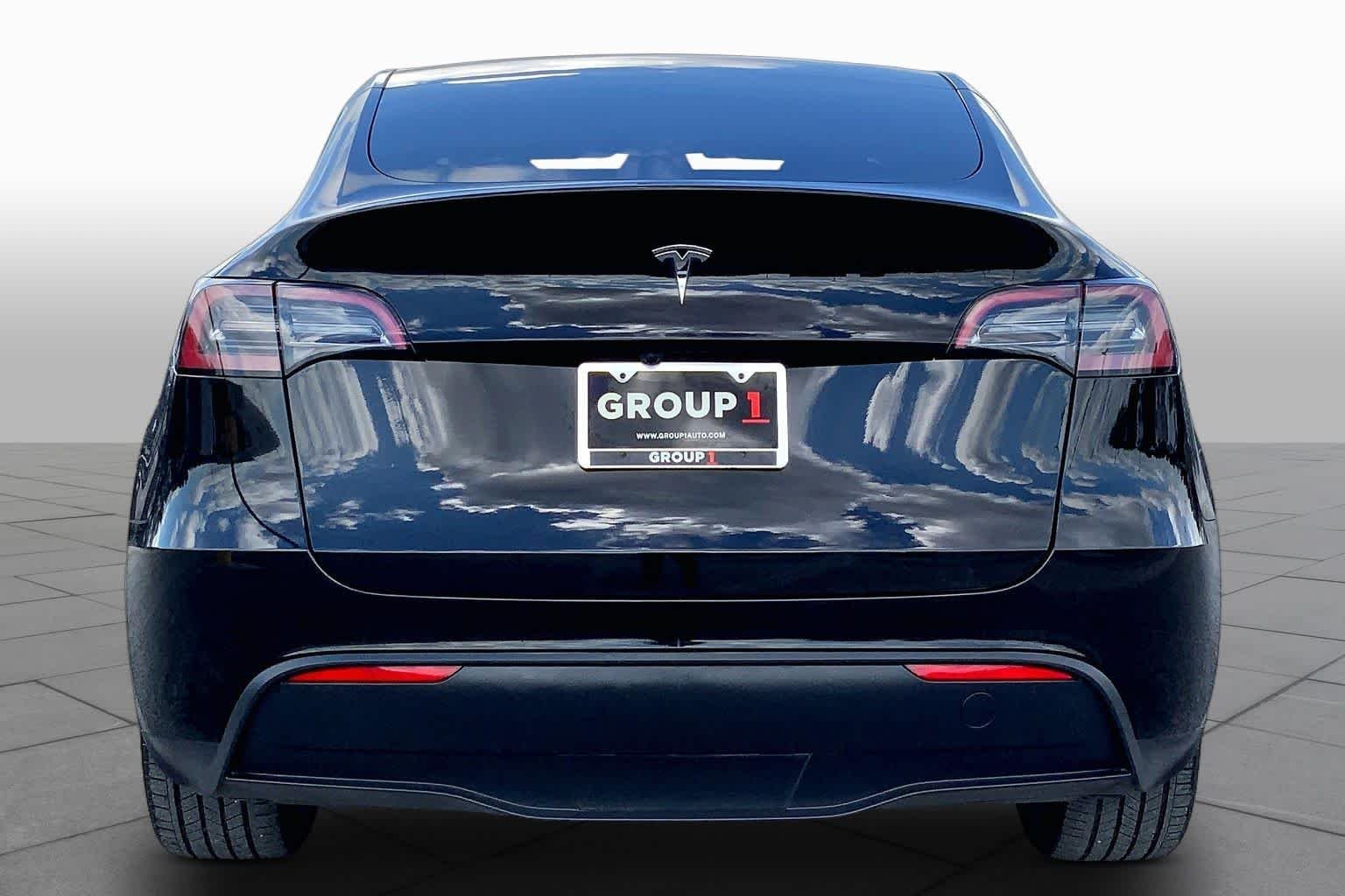 Used 2024 Solid Black Tesla  image 4