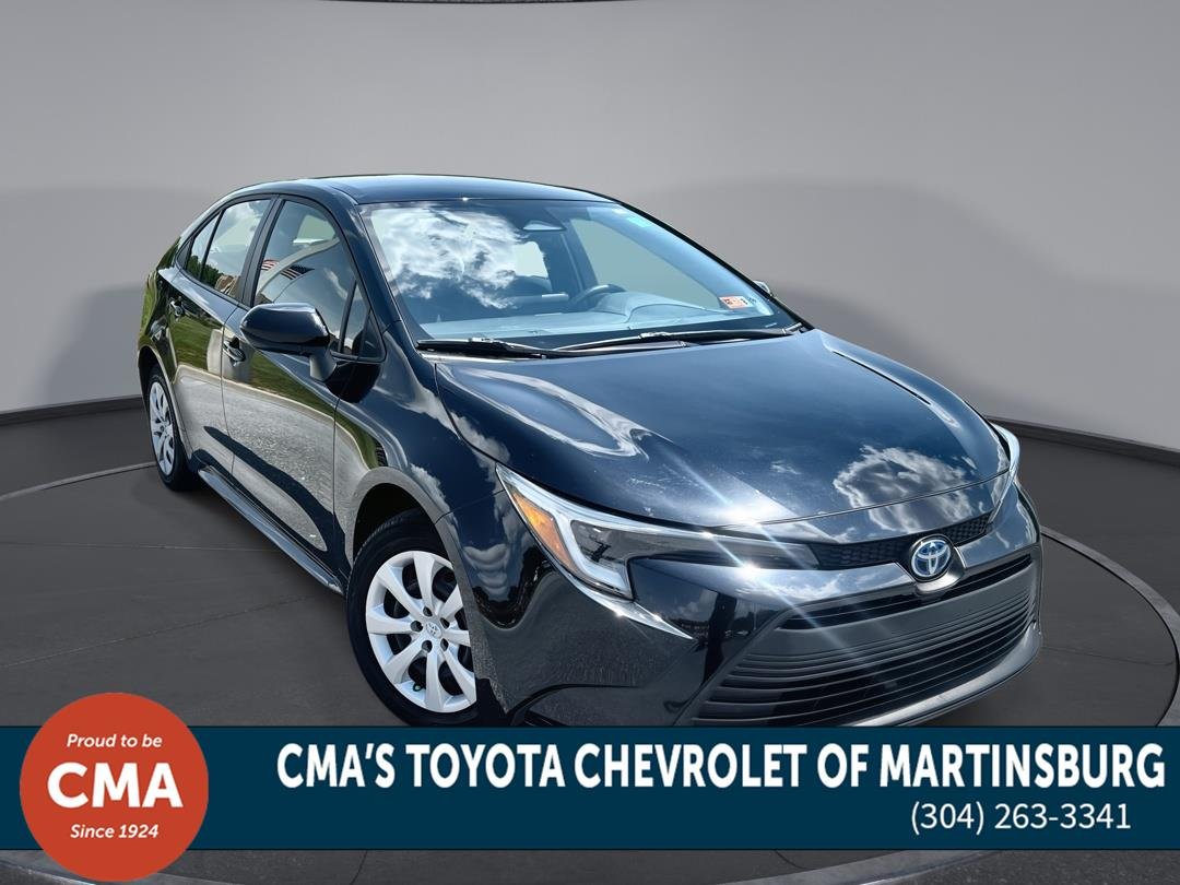 Used 2025 Midnight Black Metallic Toyota Hybrid LE image 1