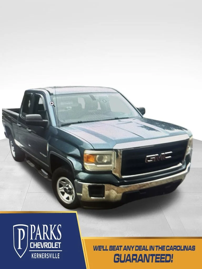 Used 2014 STEALTH GRAY METALLIC GMC DBL CAB 4WD 143.5 image 1