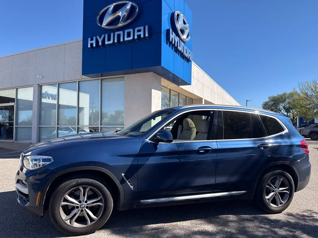 Used 2021 Blue BMW xDrive30i image 1