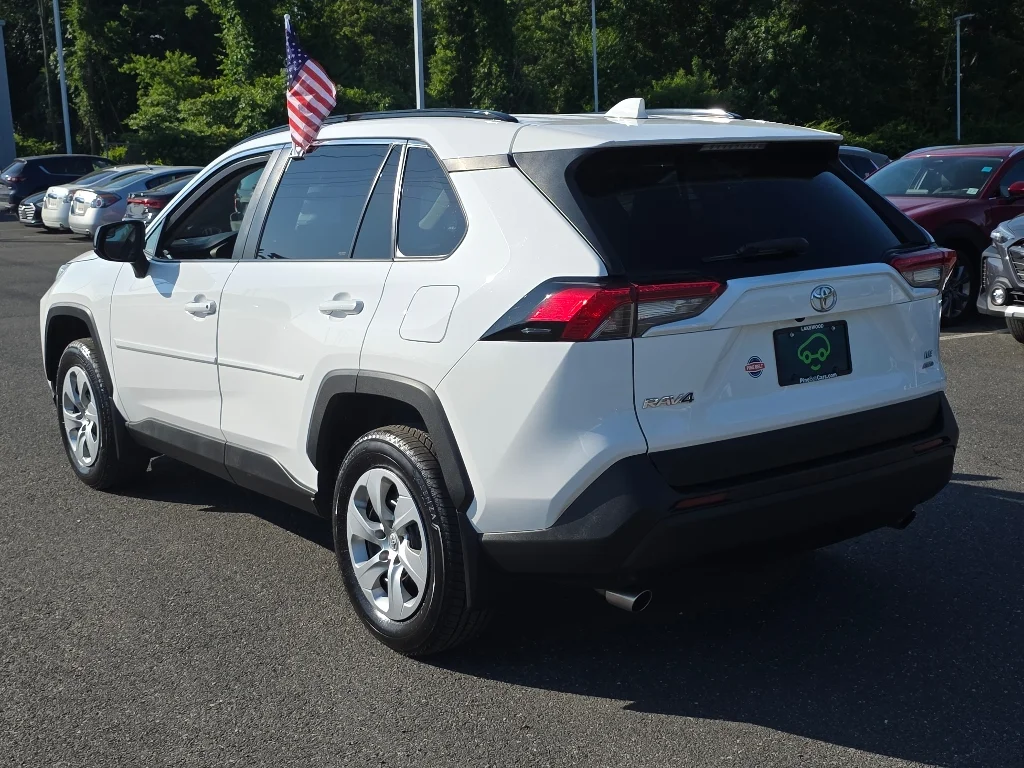 Used 2021 Super White Toyota LE image 13