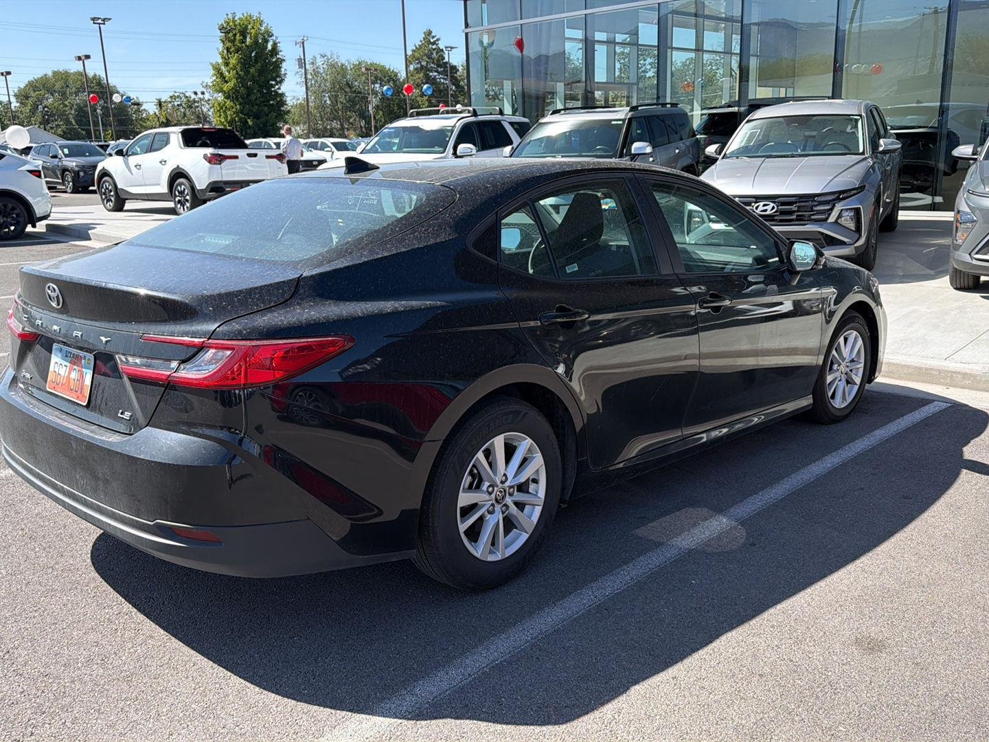 Used 2025 Midnight Black Metallic Toyota LE image 2