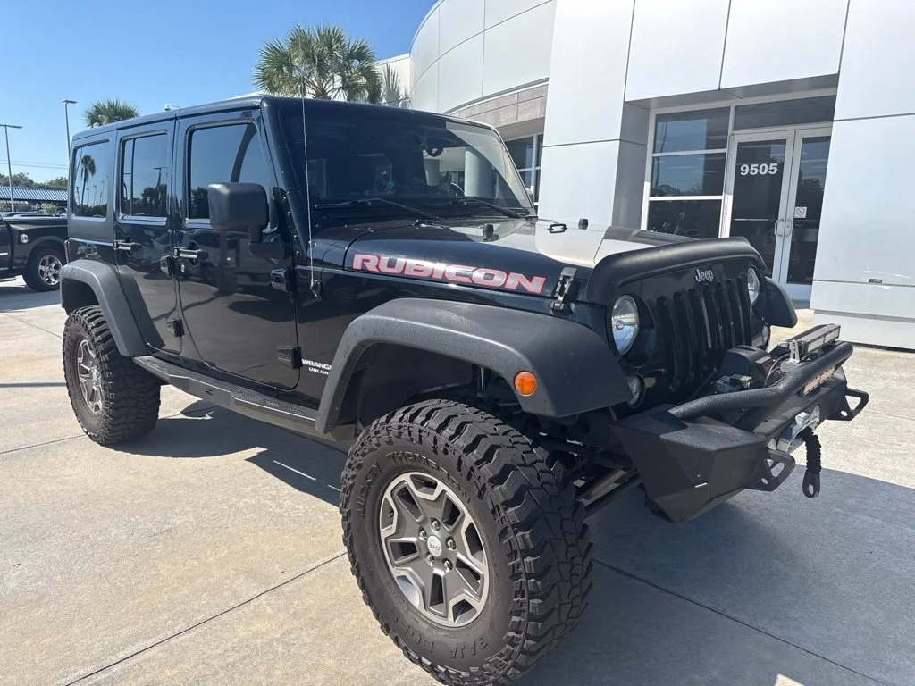 Used 2014 Black Clearcoat Jeep Unlimited Rubicon image 1