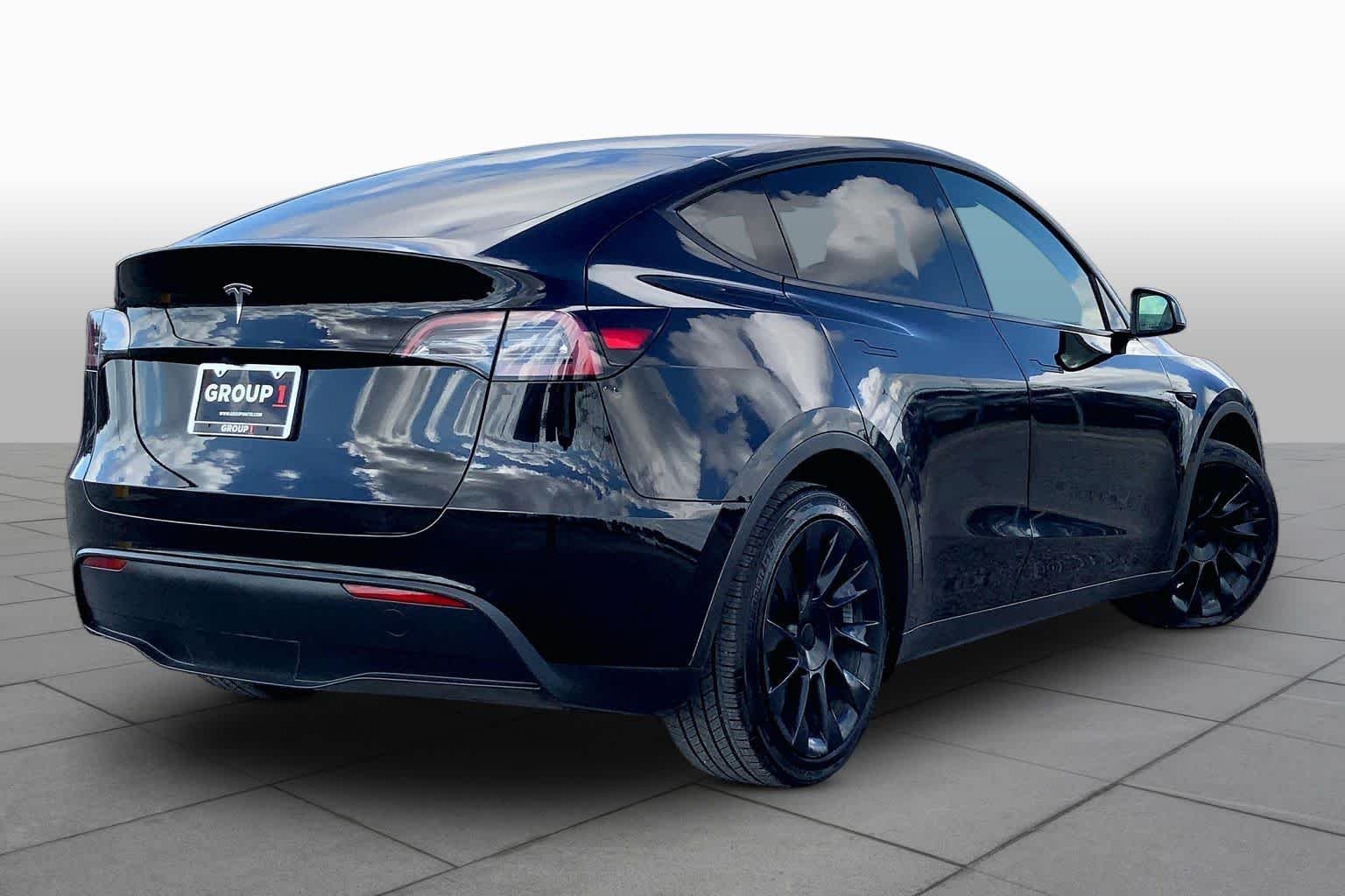 Used 2024 Solid Black Tesla  image 12