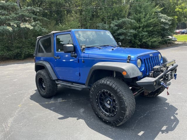 Used 2014 Flame Red Clearcoat Jeep Sport image 1