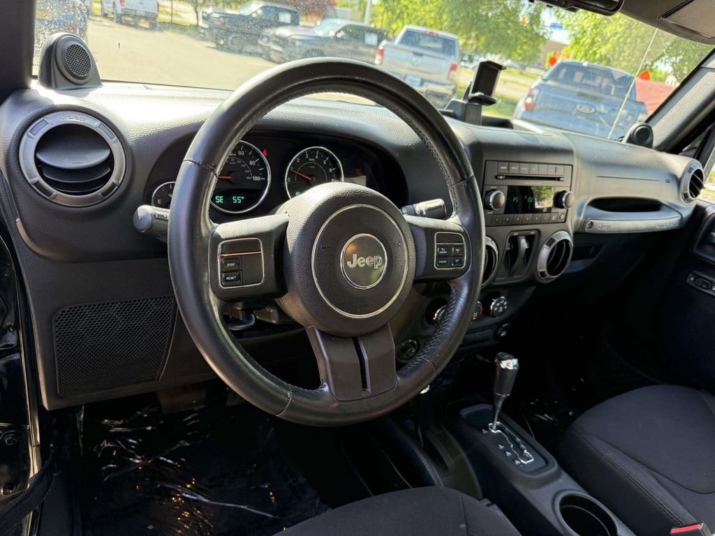 Used 2014 Black Jeep Sport image 2