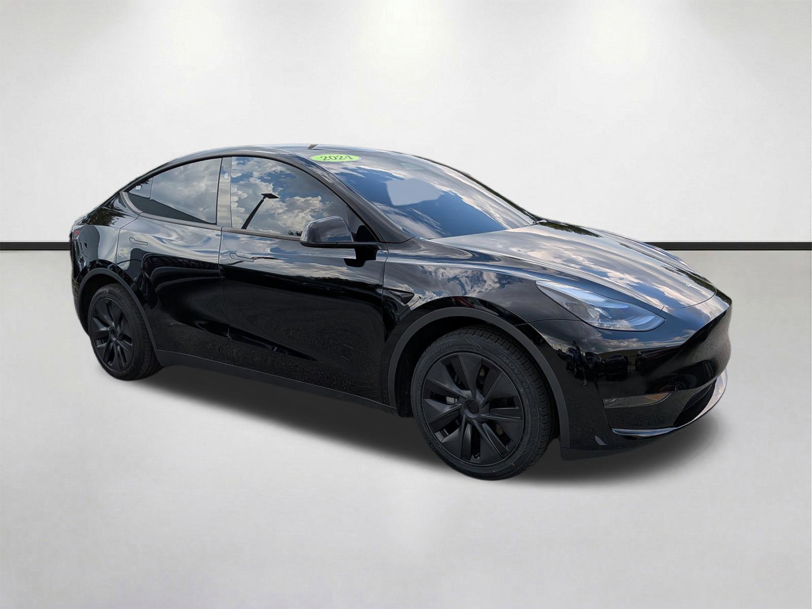 Used 2024 Tesla Model Y Long Range with VIN 7SAYGDED9RF205402 for sale in Fort Myers, FL