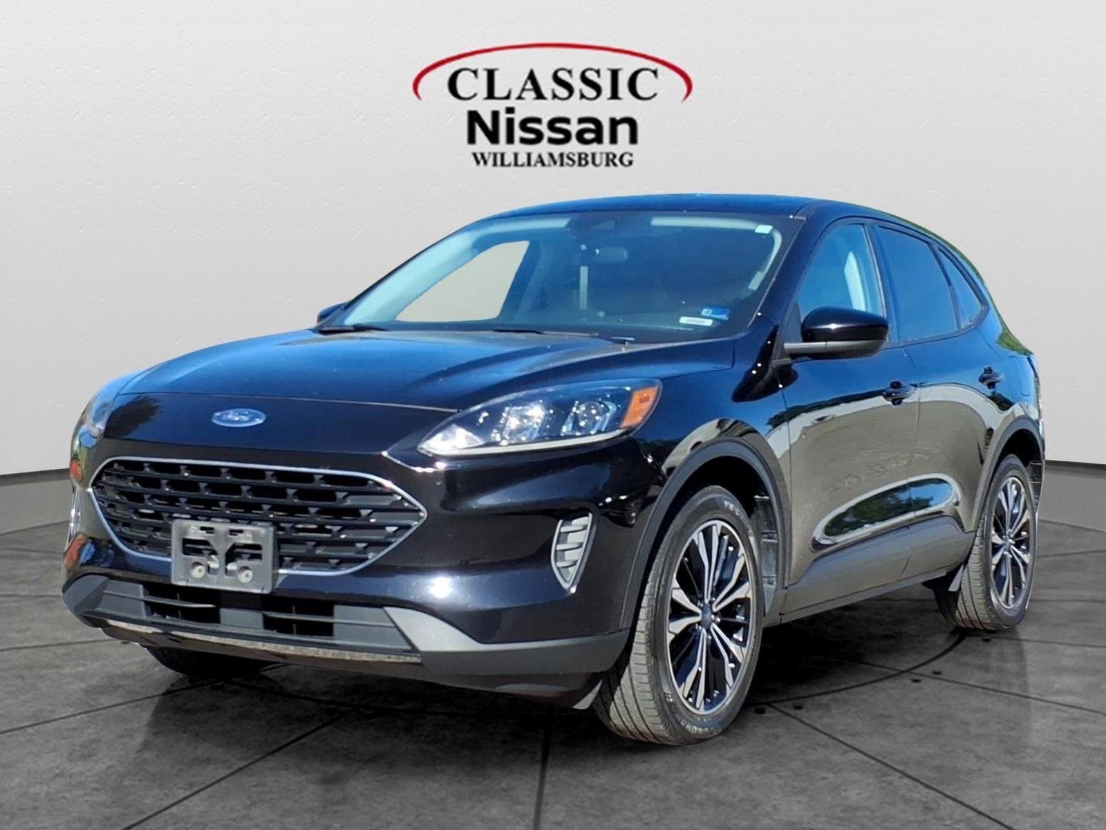 Used 2021 Agate Black Metallic Ford SE Hybrid image 1