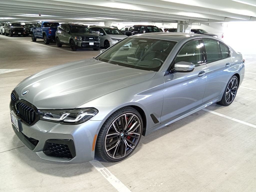 Used 2023 Skyscraper Gray Metallic BMW M550i xDrive image 1